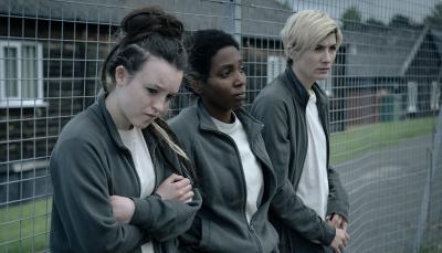 Bella Ramsey as Kelsey, Tamara Lawrance as Abi, and Jodie Whittaker as Orla in the prison yard 'Time' Season 2